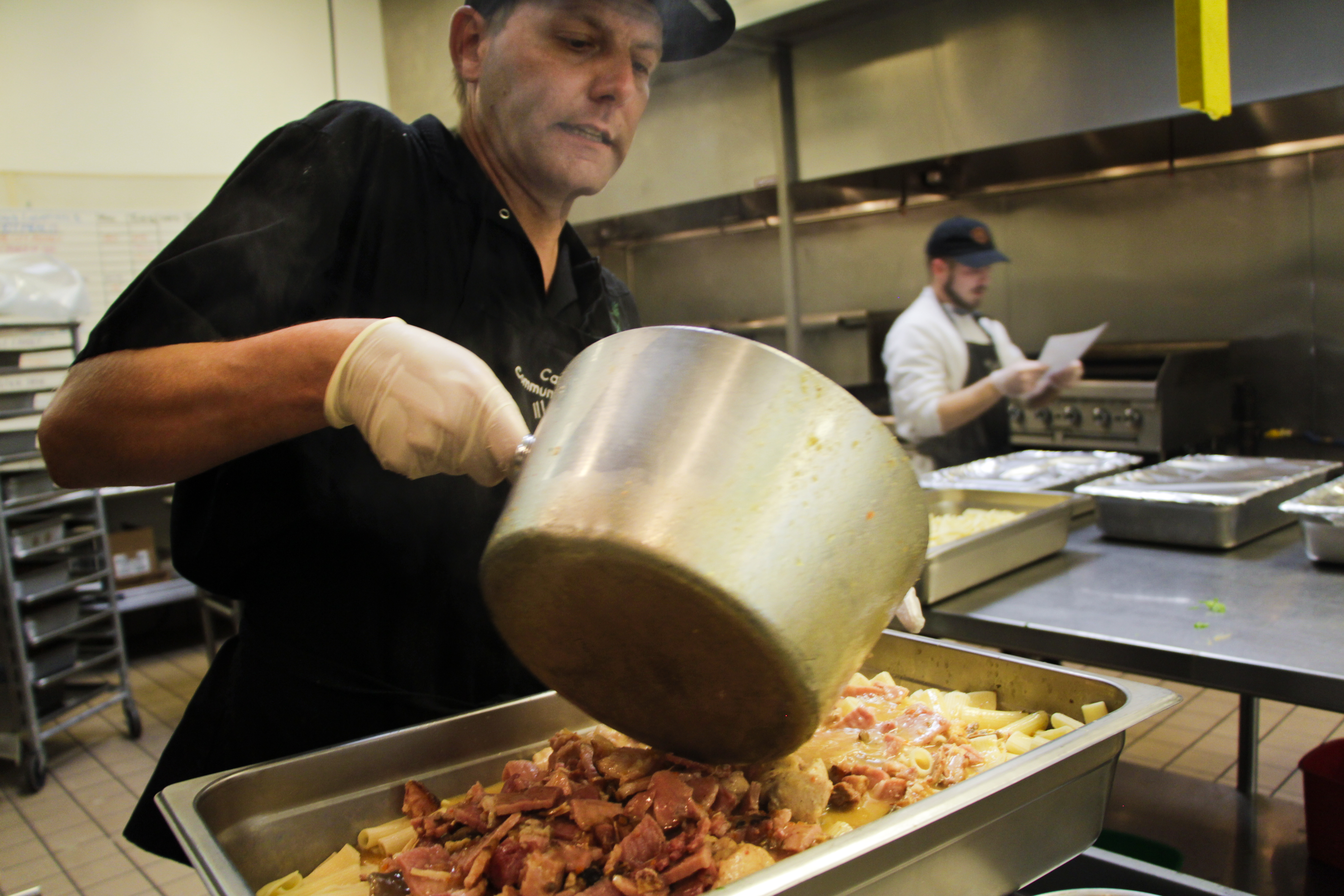 David Rogers, 39, who struggled with drug and alcohol addiction, is a graduate of the culinary training program at the Caridad Community Kitchen food bank in Tucson and now works as a cook.