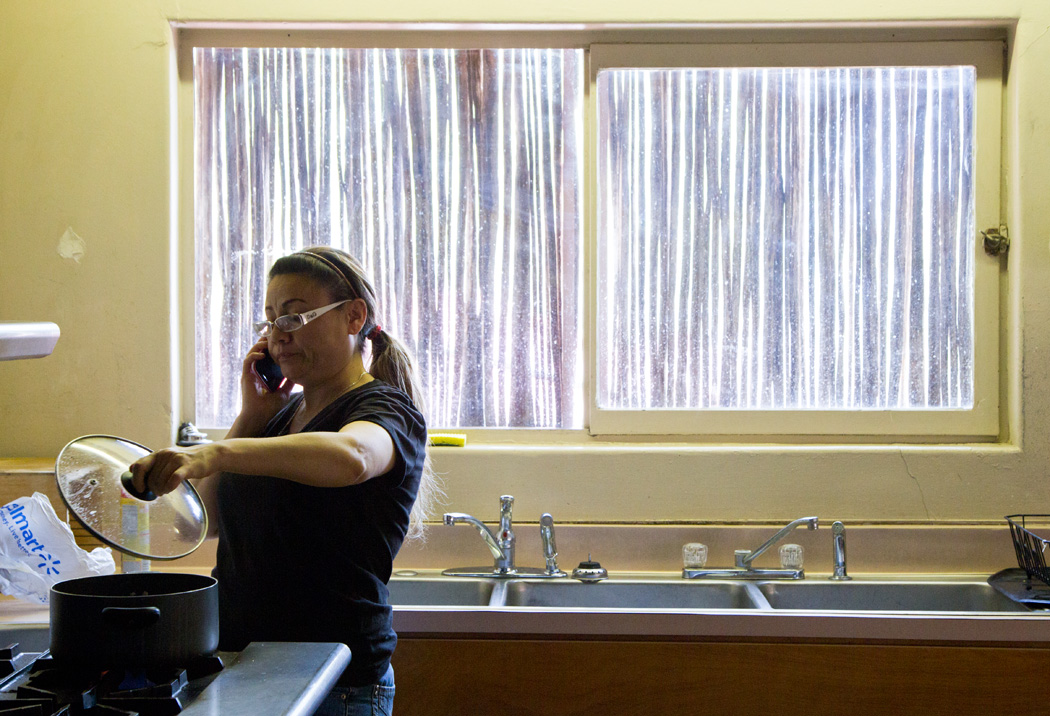  Rosa Robles cooks a meal for her husband before he comes to visit her from work.