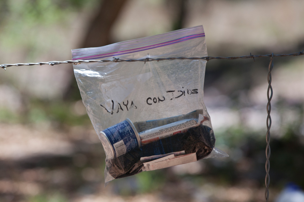 A bag of essentials left by the Tucson Samaritans group at the U.S.-Mexican border for migrants read, "Go With God."