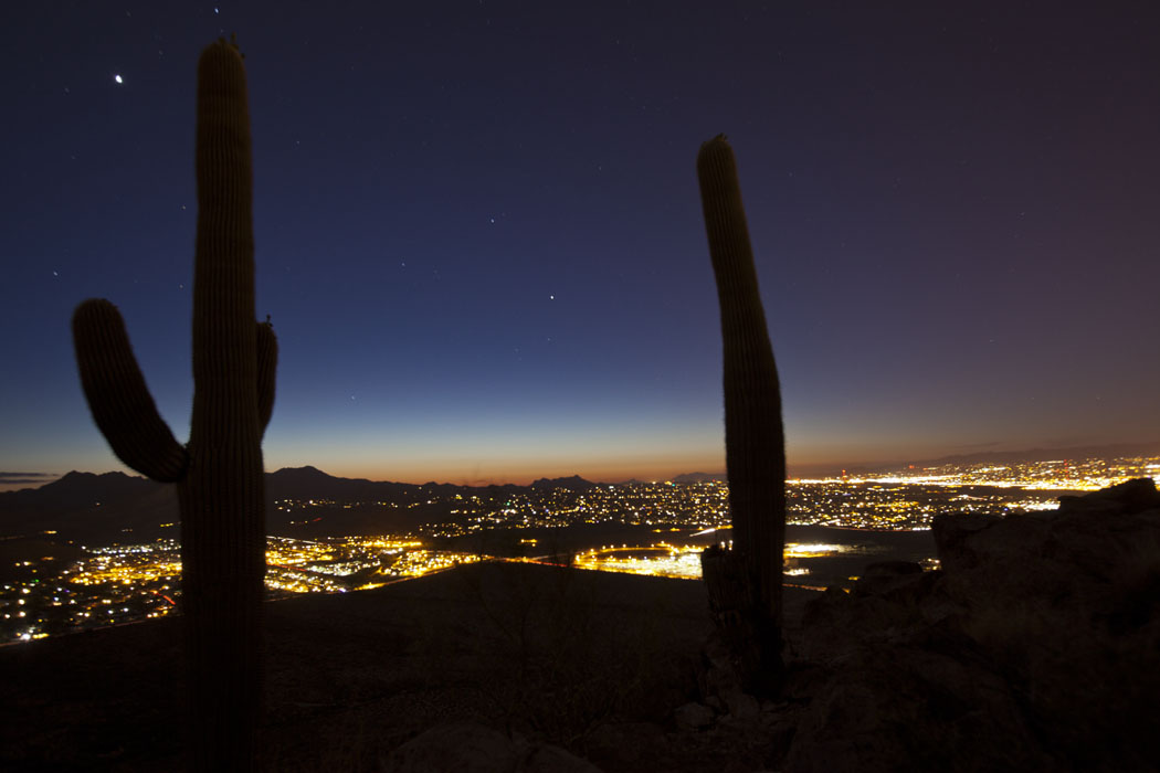 A Tucson sunset viewed from Tumamoc Hill. Light pollution from a developing open-pit copper mine could contaminate the view of the city’s night sky.