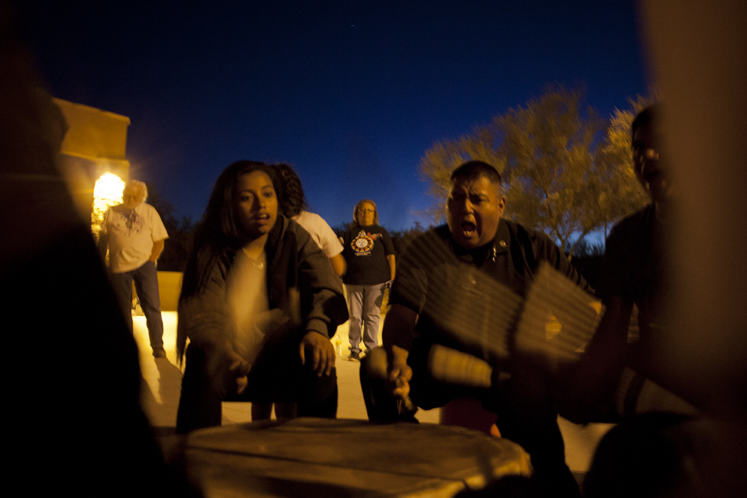 Members of the Tohono O'odham’s drum group, Four Winds, began a chant at the plaza in Sells, signaling the start of the vigil organized by Tohono O'odham Hemajkam Rights group for the lives affected by Border Patrol.