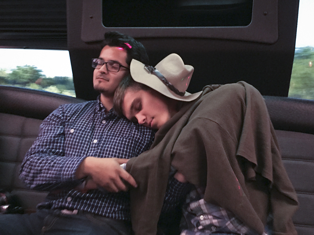 After a Memorial Day barbecue, Ben Bartenstein, right, and Santiago Mejia take a moment to rest on the bus ride back.