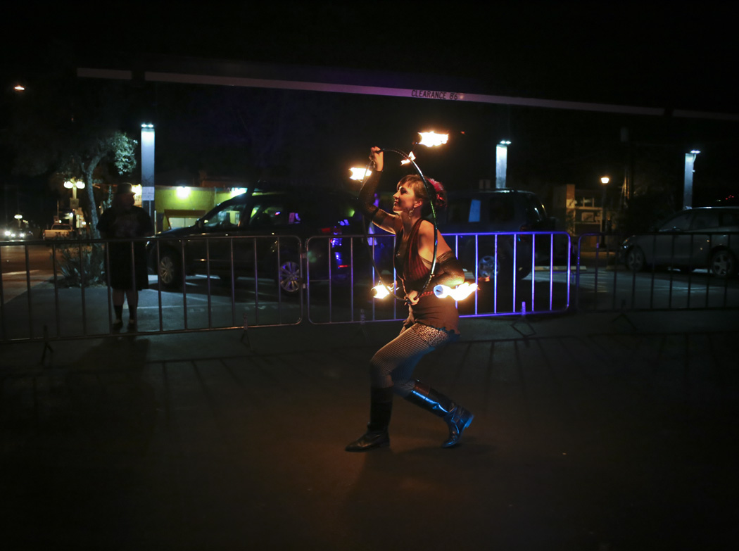 Zoe Rae, 31, performs a fire show using a hula hoop, May 22, 2015, Tucson, Arizona.