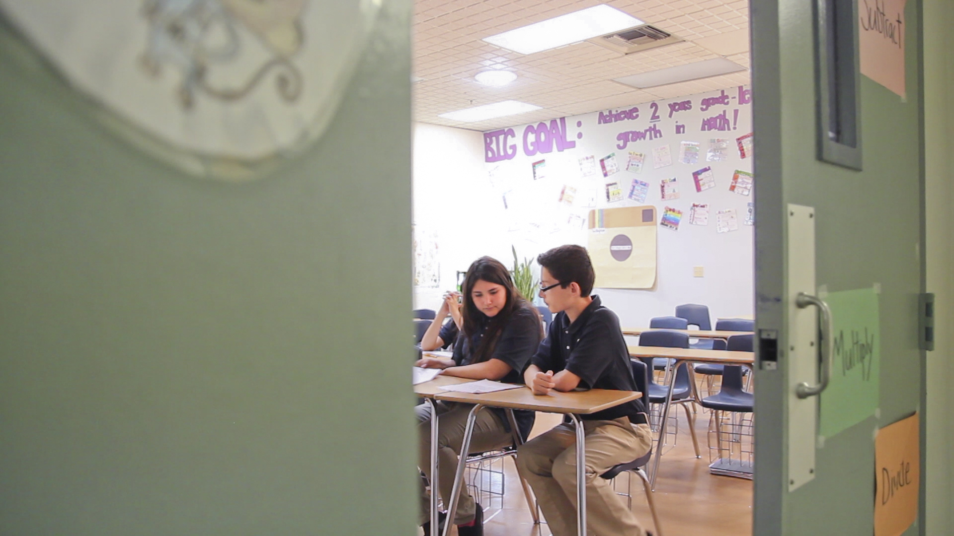 Seventh graders studied in math class on the last day of school at Imago Dei. All of the school's students who have gone on to high school have graduated or passed a G.E.D. test.